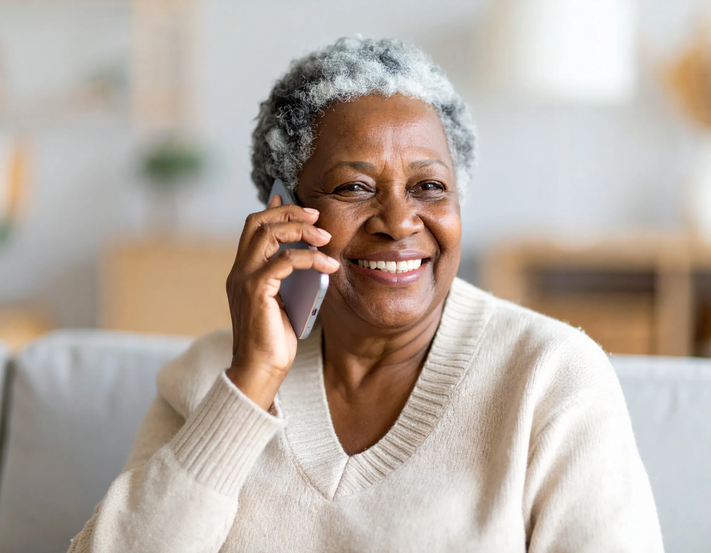Senior patient receiving automated wellness check-in call from healthcare provider