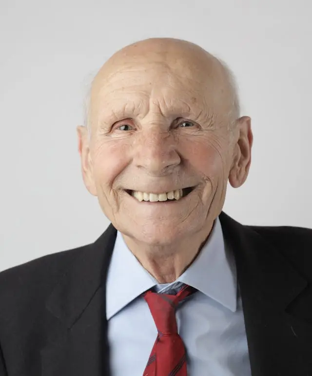 Senior person smiling and looking content