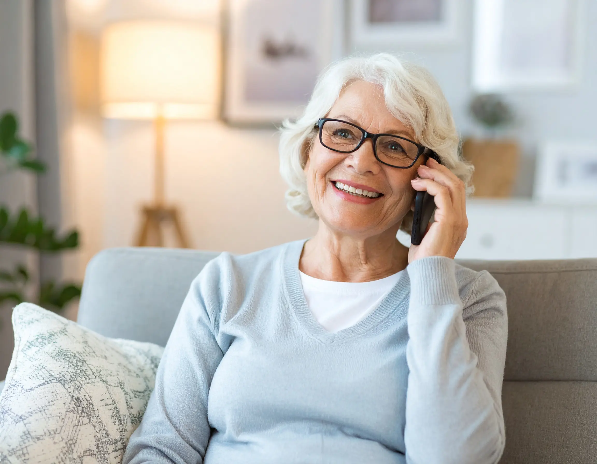 Senior citizen engaged in friendly wellness conversation with AI companion Lola