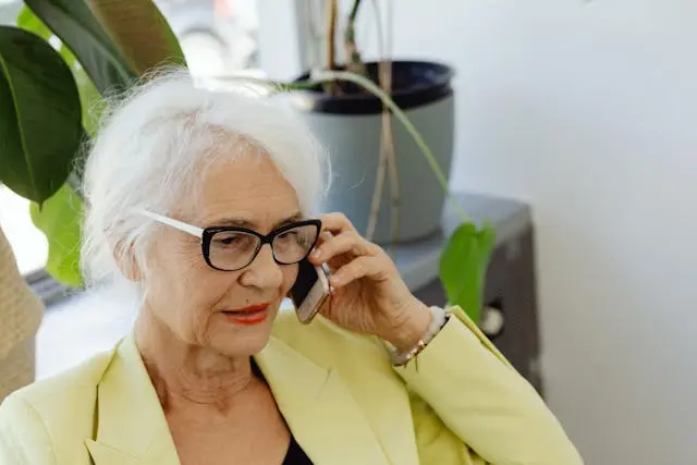Senior person having a phone conversation
